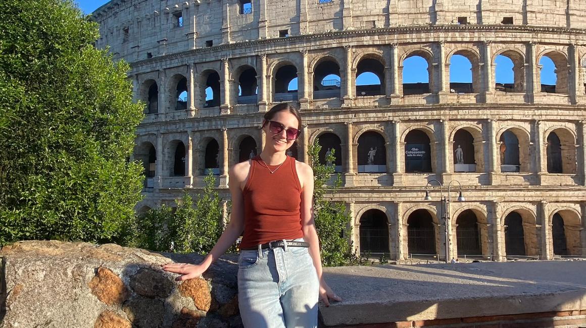 Image of Catherine Startup in front of the Colosseum in Rome, Italy