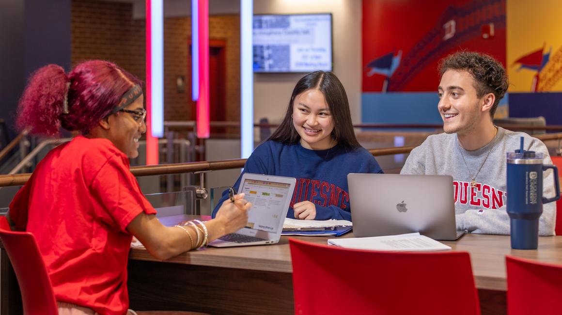 Duquesne students chatting in Towers lobby.