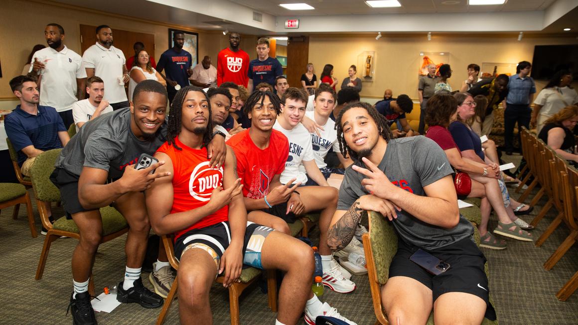 The Duquesne men's basketball team is pictured at the Juneteenth 2024 event.
