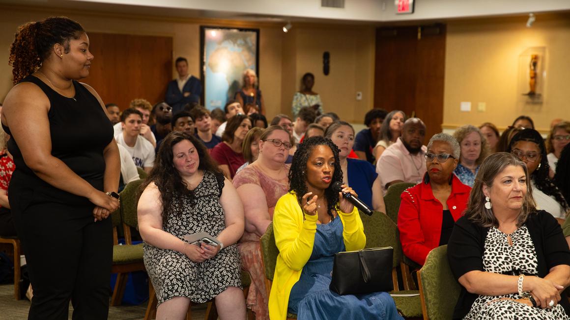 An audience member asks a question to the guest speaker at Juneteenth 2024.