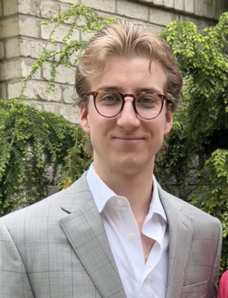 Extern R. Neill Peirce grins in his headshot.