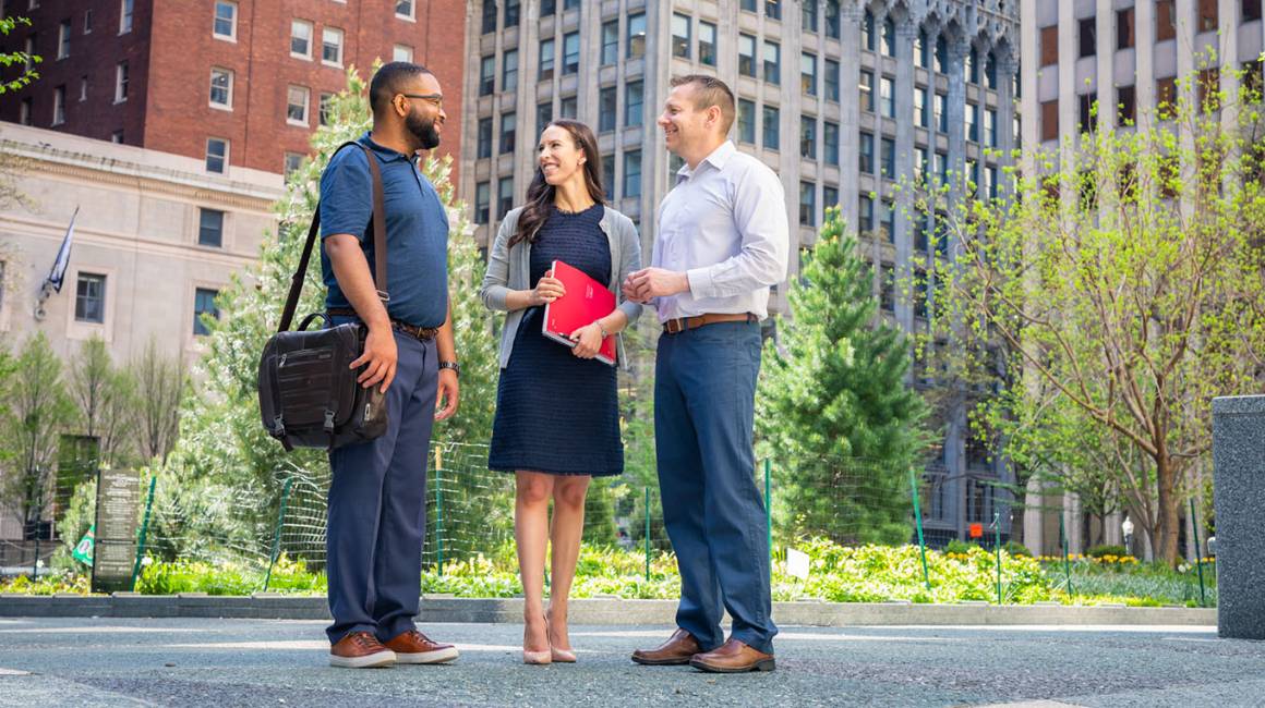 Three people talking