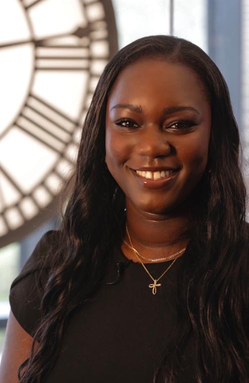 Extern Tiffeny Ayoola smiles in her headshot.